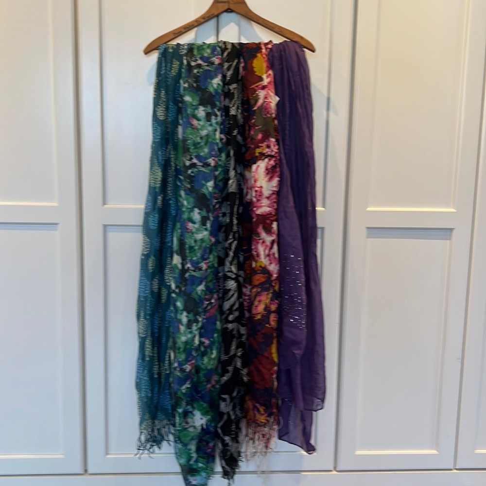 Five scarves, all different patterns and sizes